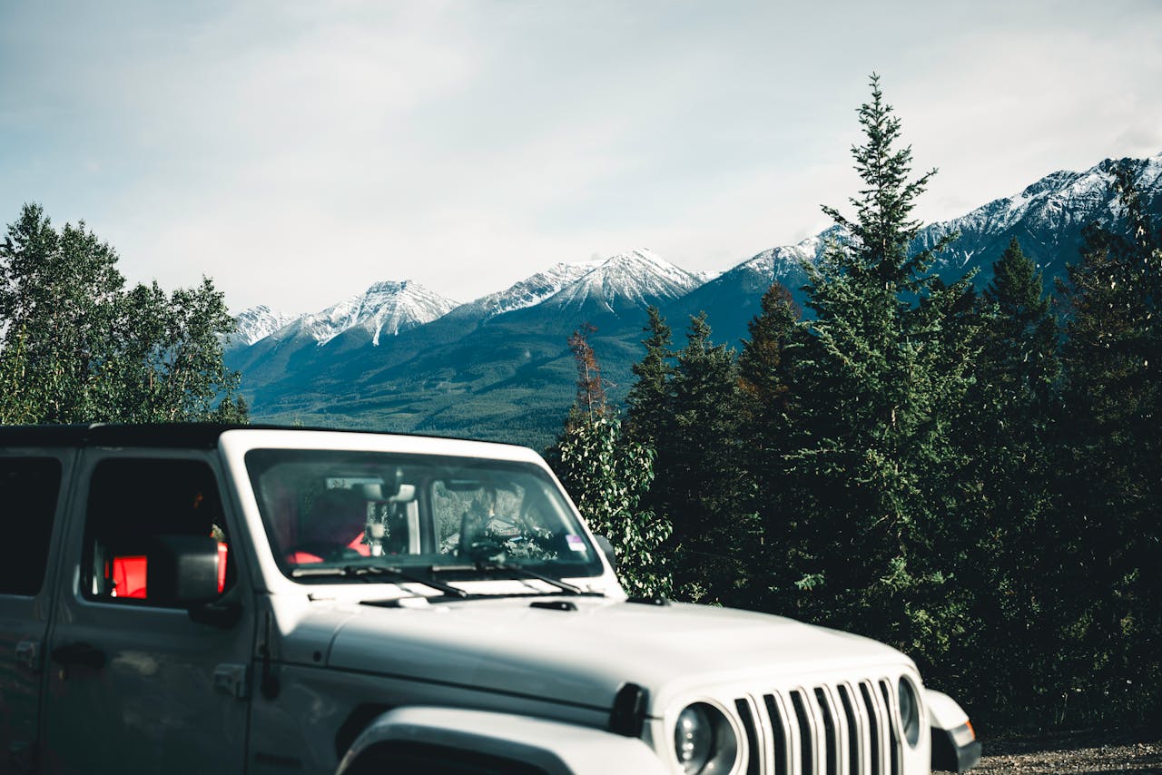 services-04 Explore the rugged beauty of Golden, BC with a classic off-road vehicle and stunning mountain views.